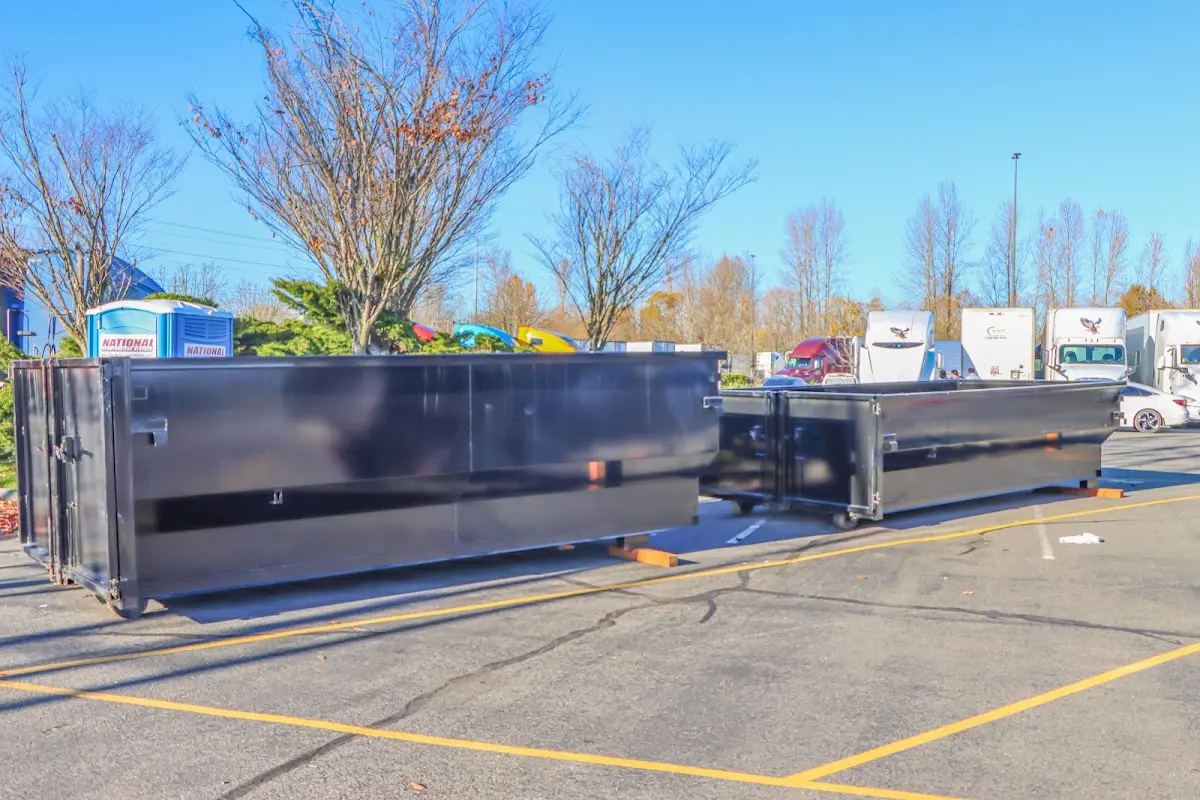 Professional dumpster rental service with roll-off container on residential driveway in San Tan Valley